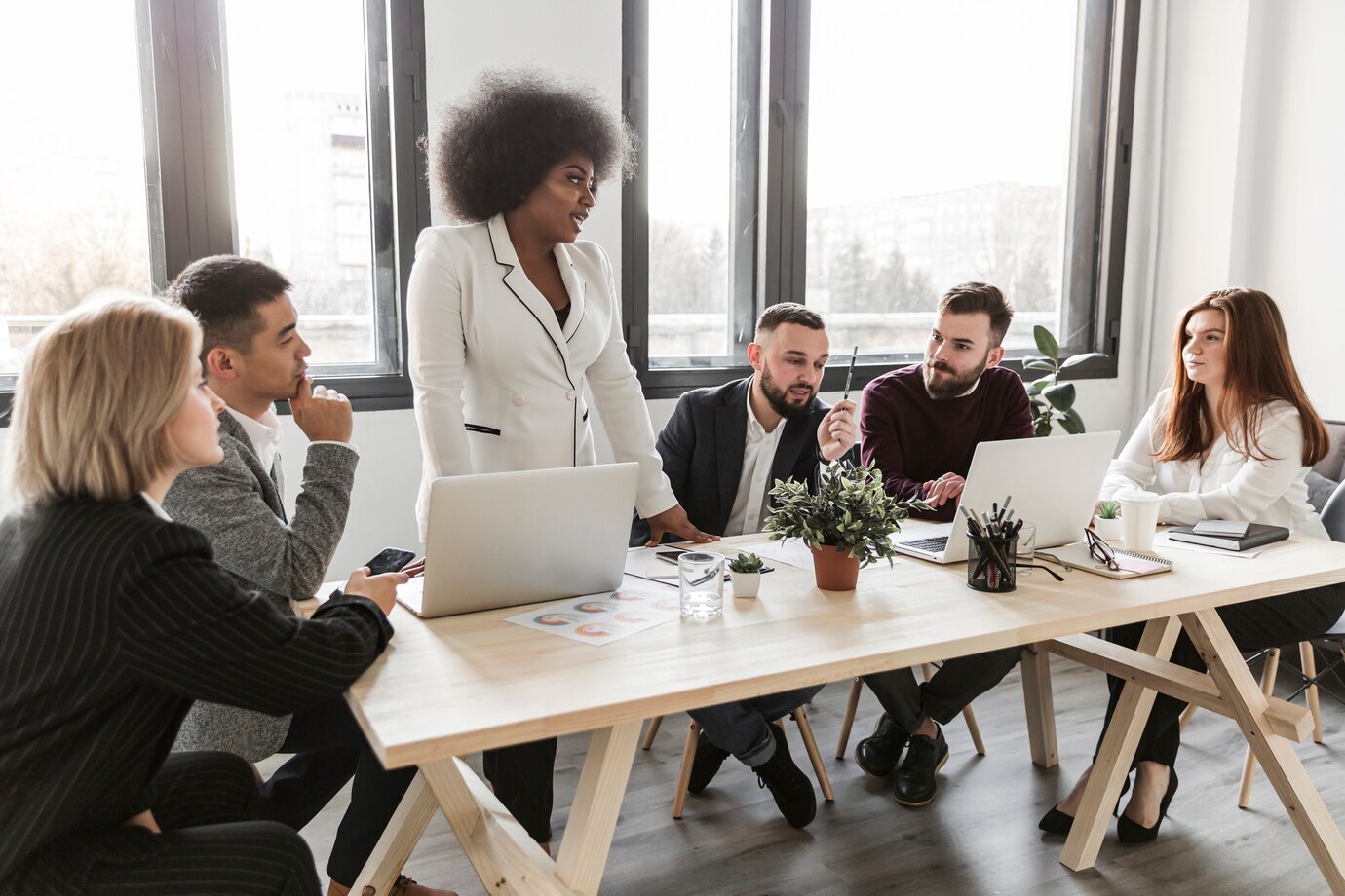 front-view-business-people-meeting_23-2148427150